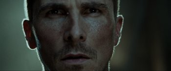Movie still from “Terminator Salvation” (2009), directed by McG – A man's face in a dark room; Extreme Close Up shot, Low angle