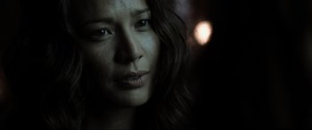 Movie still from “Terminator Salvation” (2009), directed by McG – A woman's face in the dark; Close Up shot, Over the shoulder angle