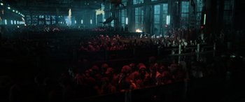 Movie still from “Terminator Salvation” (2009), directed by McG – A group of people sitting in a large room at night; Extreme Wide shot, High angle