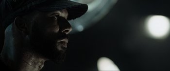 Movie still from “Terminator Salvation” (2009), directed by McG – A person wearing a hat; Close Up shot, Low angle