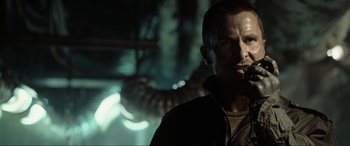 Movie still from “Terminator Salvation” (2009), directed by McG – A person in a dark room; Close Up shot, Low angle