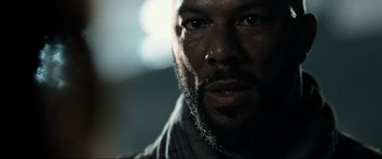 Movie still from “Terminator Salvation” (2009), directed by McG – A person with a beard; Close Up shot, Over the shoulder angle