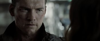 Movie still from “Terminator Salvation” (2009), directed by McG – A person wearing a black jacket; Close Up shot, Over the shoulder angle