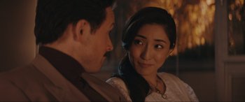 Movie still from “Tetris” (2023), directed by Jon S. Baird – A man and a woman looking at one another; Close Up shot, Over the shoulder angle