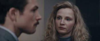 Movie still from “Tetris” (2023), directed by Jon S. Baird – A man and a woman looking at one another; Close Up shot, Over the shoulder angle