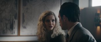 Movie still from “Tetris” (2023), directed by Jon S. Baird – A man and a woman are looking at one another; Close Up shot, Over the shoulder angle