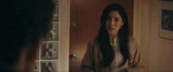 Movie still from “Tetris” (2023), directed by Jon S. Baird – A woman standing in front of a glass door; Close Up shot, Over the shoulder angle