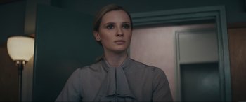 Movie still from “Tetris” (2023), directed by Jon S. Baird – A woman in a grey shirt looking to her left; Close Up shot, Low angle