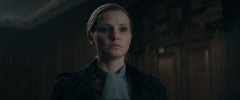 Movie still from “Tetris” (2023), directed by Jon S. Baird – A person wearing a jacket; Close Up shot, Low angle