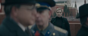 Movie still from “Tetris” (2023), directed by Jon S. Baird – A man and a woman in military uniforms; Close Up shot, Over the shoulder angle