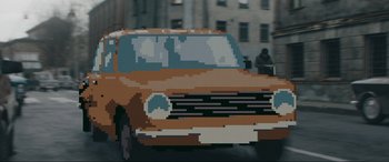 Movie still from “Tetris” (2023), directed by Jon S. Baird – An image of an old car in the middle of the street; Extreme Close Up shot, Over the shoulder angle