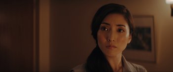 Movie still from “Tetris” (2023), directed by Jon S. Baird – A person with long black hair; Close Up shot, Low angle