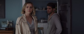 Movie still from “That's Amor” (2022), directed by Shaun Paul Piccinino – A man and a woman standing next to each other in a kitchen; Medium shot, Over the shoulder angle