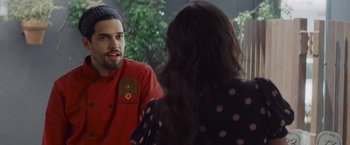 Movie still from “That's Amor” (2022), directed by Shaun Paul Piccinino – A man and a woman talking to each other; Close Up shot, Over the shoulder angle