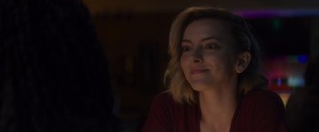 Movie still from “That's Amor” (2022), directed by Shaun Paul Piccinino – A person sitting in front of a window; Close Up shot, Over the shoulder angle