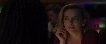 Movie still from “That's Amor” (2022), directed by Shaun Paul Piccinino – A person holding their hand up to her face; Close Up shot, Over the shoulder angle