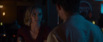 Movie still from “That's Amor” (2022), directed by Shaun Paul Piccinino – A woman looking at a man in the mirror; Close Up shot, Over the shoulder angle