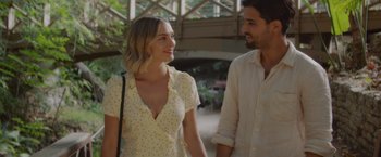 Movie still from “That's Amor” (2022), directed by Shaun Paul Piccinino – A man and a woman are walking together; Medium shot, Over the shoulder angle