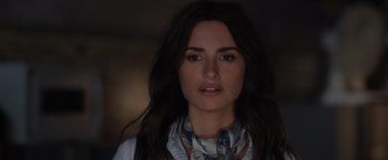 Movie still from “The 355” (2022), directed by Simon Kinberg – A person wearing a neck scarf; Close Up shot, Low angle