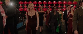 Movie still from “The 355” (2022), directed by Simon Kinberg – A group of women walking down a red carpet; Medium shot, High angle