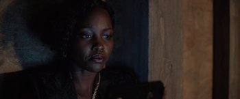 Movie still from “The 355” (2022), directed by Simon Kinberg – A person using a cell phone; Close Up shot, Over the shoulder angle