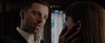 Movie still from “The 355” (2022), directed by Simon Kinberg – A person and a man looking at each other; Close Up shot, Over the shoulder angle