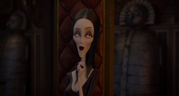 Movie still from “The Addams Family 2” (2021), directed by Greg Tiernan – A woman with long hair and a black dress; Medium shot, Over the shoulder angle