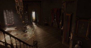 Movie still from “The Addams Family 2” (2021), directed by Greg Tiernan – An empty living room with wooden floors and a large window; Extreme Wide shot, High angle