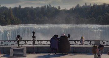 Movie still from “The Addams Family 2” (2021), directed by Greg Tiernan – A group of people standing on the side of a waterfall; Wide shot, Over the shoulder angle