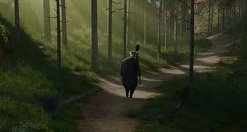 Movie still from “The Addams Family 2” (2021), directed by Greg Tiernan – A man walking down a dirt path in the woods; Wide shot, High angle