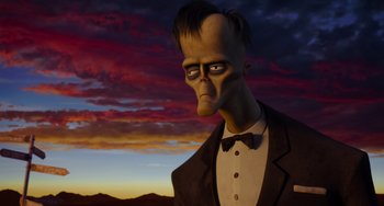 Movie still from “The Addams Family 2” (2021), directed by Greg Tiernan – An animated man in a suit and bow tie; Medium shot, Low angle