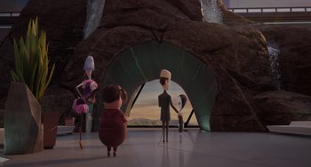 Movie still from “The Addams Family 2” (2021), directed by Greg Tiernan – A group of people standing in front of a cave; Wide shot, Over the shoulder angle