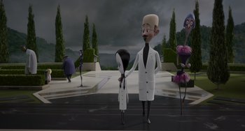 Movie still from “The Addams Family 2” (2021), directed by Greg Tiernan – Two animated characters standing next to each other in front of a building; Wide shot, Low angle