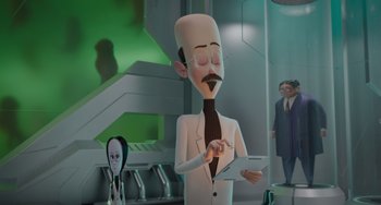 Movie still from “The Addams Family 2” (2021), directed by Greg Tiernan – An animated man in a white suit and tie holding a tablet; Medium shot, Over the shoulder angle
