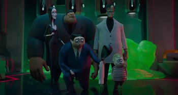 Movie still from “The Addams Family 2” (2021), directed by Greg Tiernan – A group of people standing next to each other in a room; Wide shot, Low angle