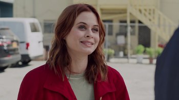 Movie still from “The Amityville Moon” (2021), directed by Thomas J. Churchill – A person wearing a red jacket; Close Up shot, Over the shoulder angle