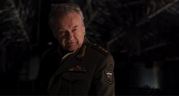 Movie still from “The Avengers” (2012), directed by Joss Whedon – An older man in a military uniform is posing for a picture; Close Up shot, Low angle