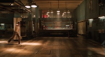 Movie still from “The Avengers” (2012), directed by Joss Whedon – An empty boxing ring in an empty gym; Extreme Wide shot, High angle