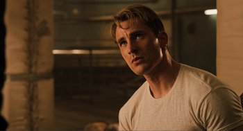 Movie still from “The Avengers” (2012), directed by Joss Whedon – A person wearing a white t - shirt; Close Up shot, Low angle