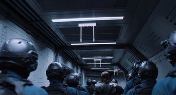 Movie still from “The Avengers” (2012), directed by Joss Whedon – A group of people standing inside of a building; Wide shot, Low angle