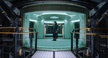 Movie still from “The Avengers” (2012), directed by Joss Whedon – A man standing on a platform in front of a building; Wide shot, Low angle