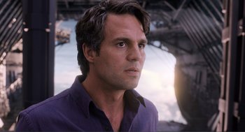 Movie still from “The Avengers” (2012), directed by Joss Whedon – A person wearing a purple shirt; Close Up shot, Over the shoulder angle