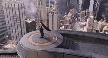 Movie still from “The Avengers” (2012), directed by Joss Whedon – A man standing on top of a building with a sword; Extreme Wide shot, High angle