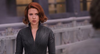 Movie still from “The Avengers” (2012), directed by Joss Whedon – A person wearing a leather jacket; Close Up shot, Over the shoulder angle