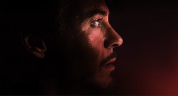 Movie still from “The Avengers” (2012), directed by Joss Whedon – A man's face in the dark; Extreme Close Up shot, Low angle