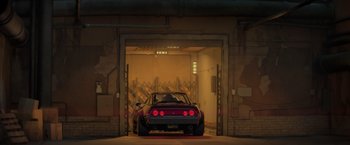 Movie still from “The Bad Guys” (2022), directed by Pierre Perifel – A red sports car parked inside of a garage; Wide shot, Low angle