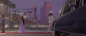 Movie still from “The Bad Guys” (2022), directed by Pierre Perifel – A man in a white suit and white hat walking down the street; Wide shot, Over the shoulder angle