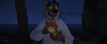 Movie still from “The Bad Guys” (2022), directed by Pierre Perifel – A dog holding a cat in his arms at night; Medium shot, High angle
