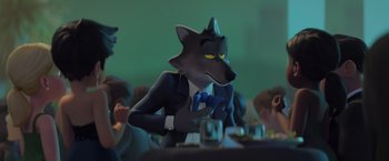 Movie still from “The Bad Guys” (2022), directed by Pierre Perifel – A man in a suit and tie sitting in front of a table; Medium shot, Over the shoulder angle