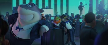 Movie still from “The Bad Guys” (2022), directed by Pierre Perifel – A group of people standing next to each other in a room; Wide shot, Low angle